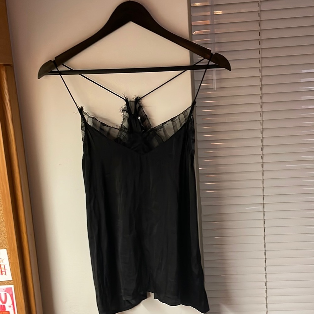 Silk black tank top with lace trim and flowy fit. Spaghetti straps.